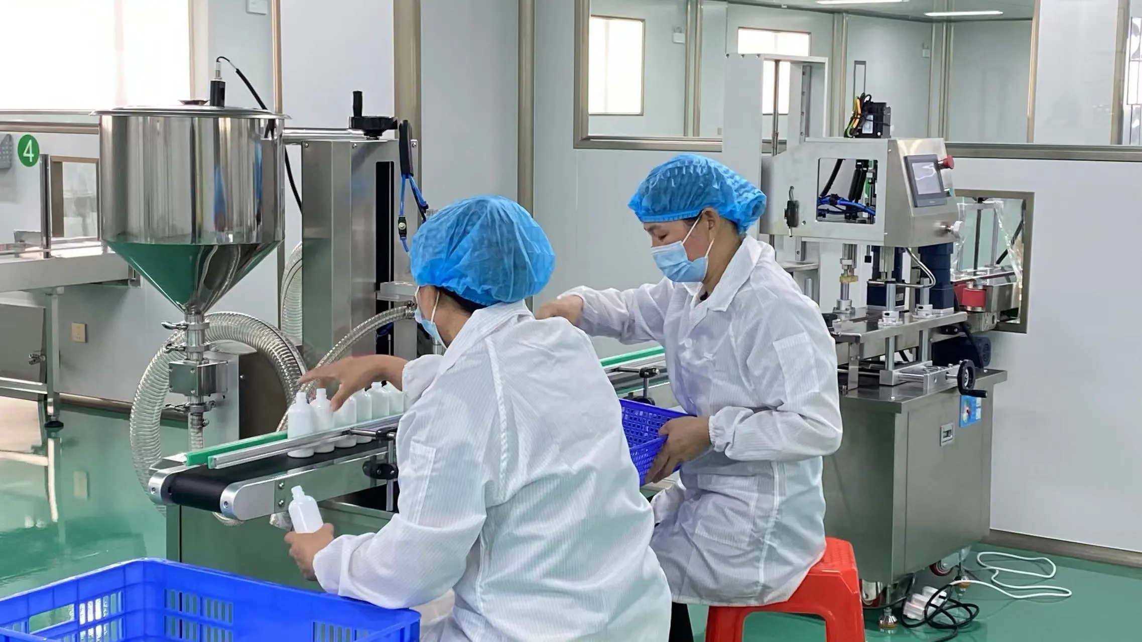 Automated filling and nozzle capping line for professional hair care products, ensuring efficient OEM production.