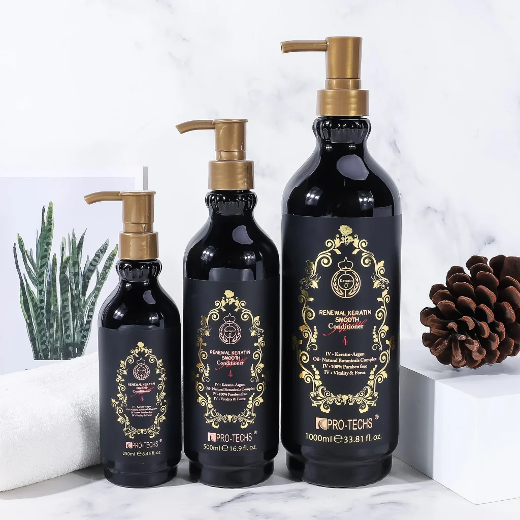 Three black bottles of "Renewal Keratin Smooth Conditioner 4" in 250ml, 500ml, and 1000ml sizes with gold pump dispensers and ornate labels, arranged by height on a marble surface next to a white towel, a potted plant, and a pinecone.