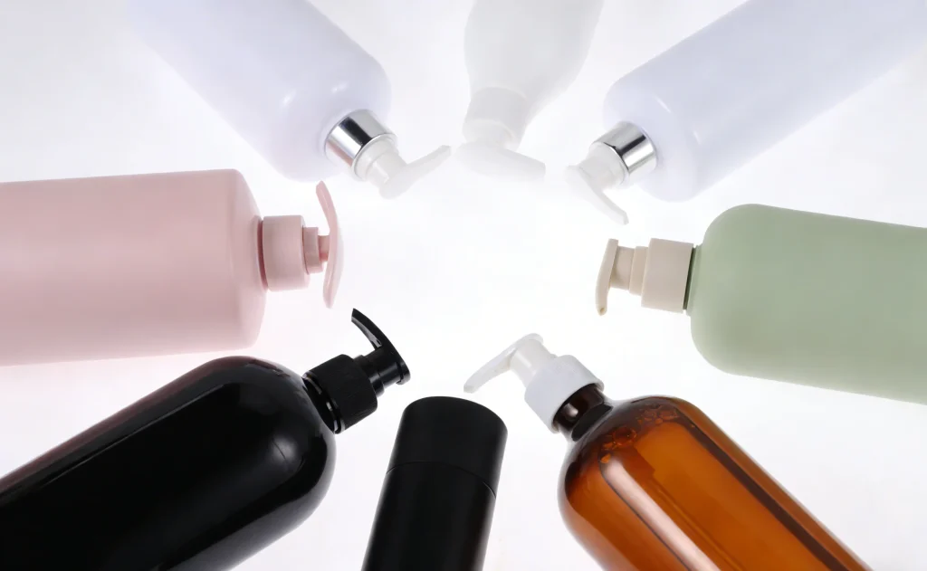 A circle of colorful blank hair care pump bottles and containers