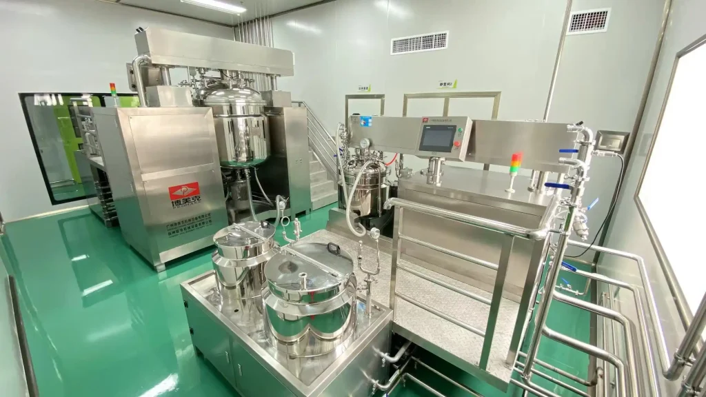 Stainless steel hair care processing line with reactors, valves, and a touchscreen control panel in a cleanroom.