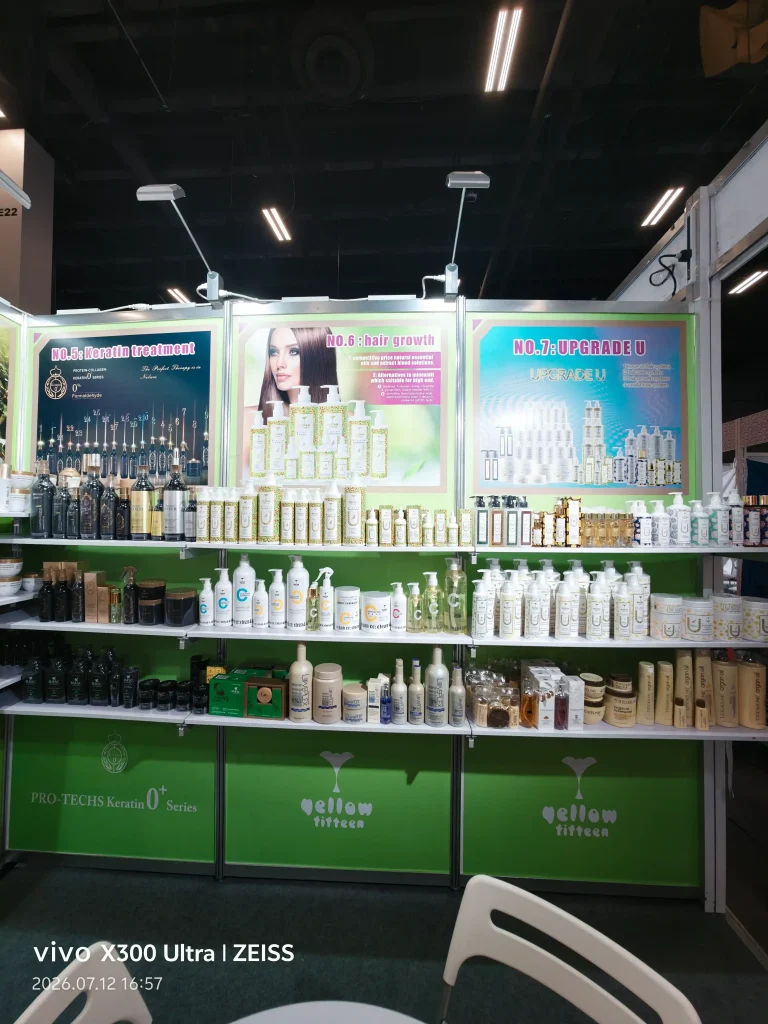 Exhibition booth displaying hair care products on shelves with posters reading No.5 Keratin treatment, No.6 hair growth, and No.7 Upgrade U