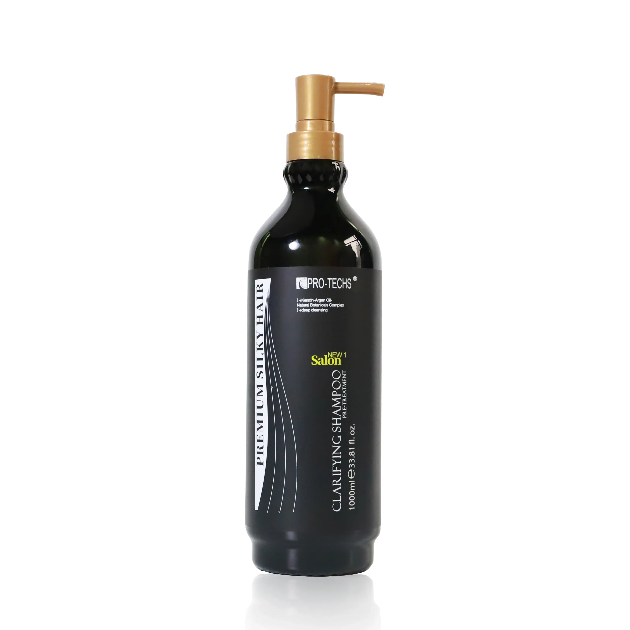 Black shampoo bottle with a gold pump dispenser on a white background, shown from the top.
