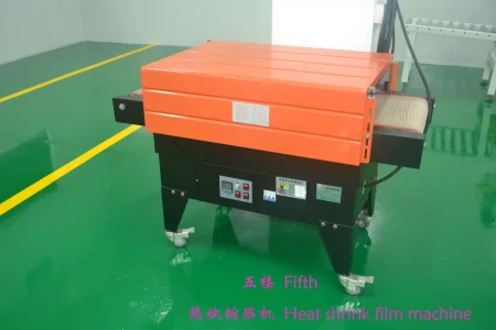 Heat shrink film machine for professional product secondary packaging.